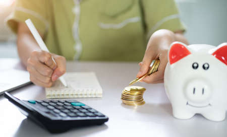 Asian woman calculating her savings