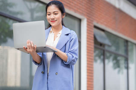 Young Asian woman working outsideの写真素材