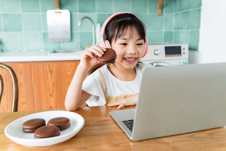 Asian child studying at home