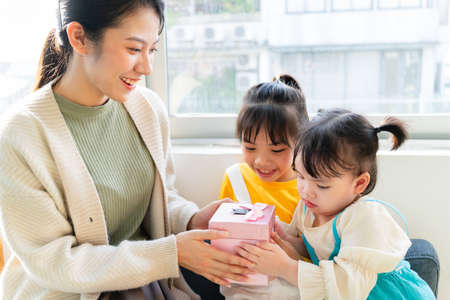 Mother and daughter make cakes together.