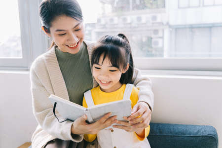 Mother and daughter relaxing at home
