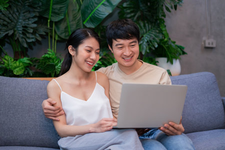 Young Asian newlyweds happy to be pregnantの写真素材