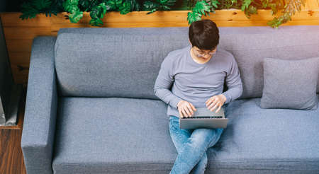 Young Asian businessman at home