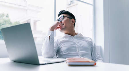 Image of young Asian doctor working at clinic