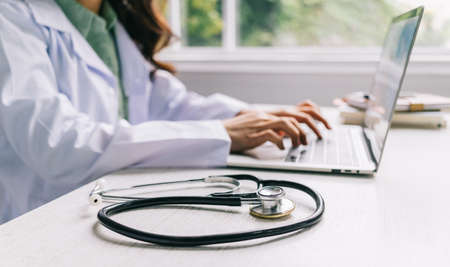 Image of Asian female doctor working at clinicの写真素材