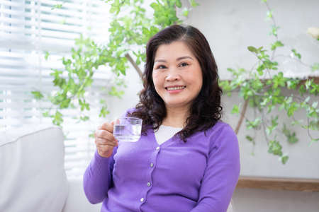 Portrait of senior Asian businesswoman at homeの写真素材