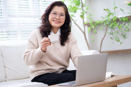 Portrait of senior Asian businesswoman at homeの写真素材