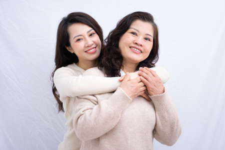 Image of Asian mother and daughter at homeの写真素材