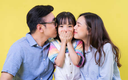 Image of young Asian family playing together at parkの写真素材