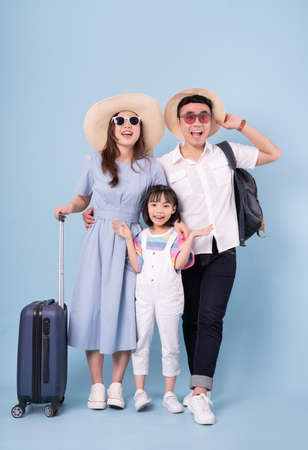 Portrait of young Asian family on backgroundの写真素材