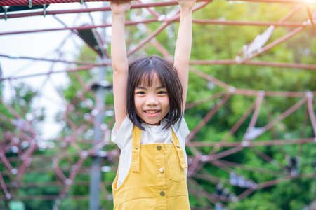Asian child playing at parkの写真素材