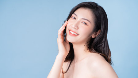 Attractive young Asian woman with fresh skin. Face care, facial treatment, , woman beauty skin isolated on white background. cosmetology, beauty skin and cosmetic conceptの写真素材