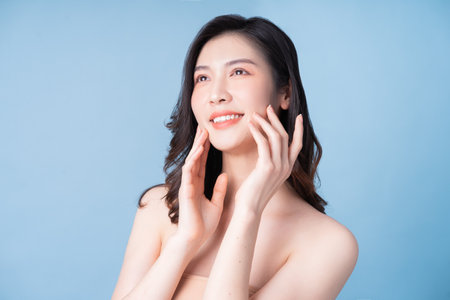 Attractive young Asian woman with fresh skin. Face care, facial treatment, , woman beauty skin isolated on white background. cosmetology, beauty skin and cosmetic conceptの写真素材