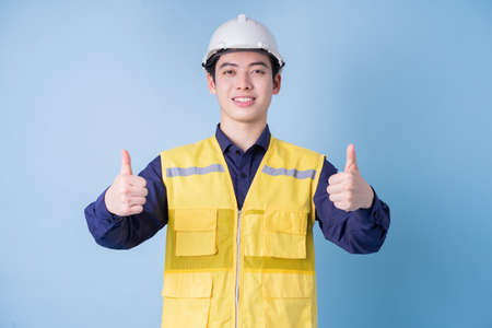 Construction worker portrait on blue background