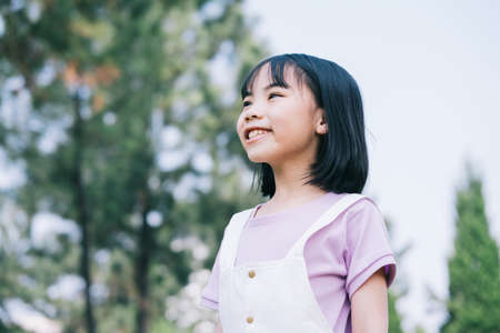 Image of Asian little girl studying at parkの写真素材