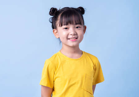 Image of Asian child practicing to be a chefの写真素材