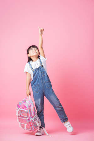 Image of Asian child with suitcase, summer conceptの写真素材