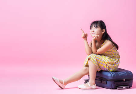 Image of Asian child listening music on backgroundの写真素材