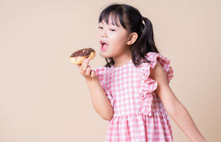 Image of Asian child listening music on background
