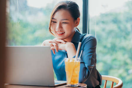 Image of young Asian businesswoman outsideの写真素材