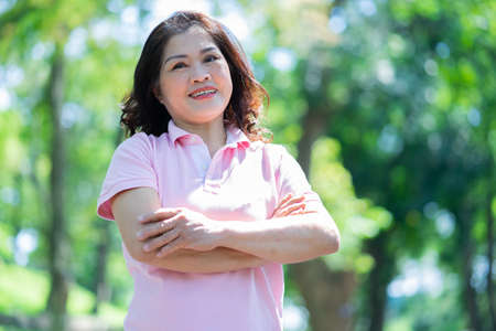 Image of middle age Asian woman exercise at parkの写真素材