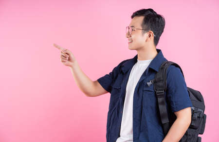 Full length image of young Asian man on white background