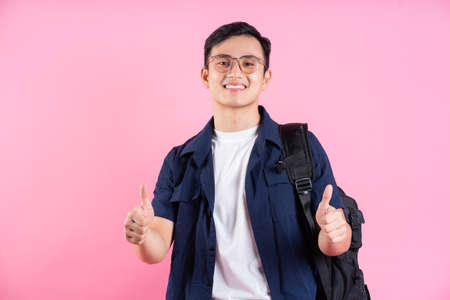 Image of young Asian businessman on backgroundの写真素材