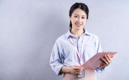 Young Asian woman preparing to cook in the kitchenの写真素材