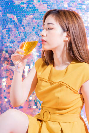 Full length photo of young Asian businesswoman on blue backgroundの写真素材
