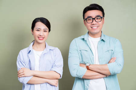 Image of young Asian couple using smartphoneの写真素材