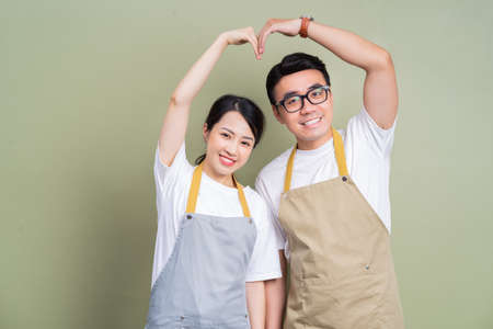 Image of young Asian couple using smartphoneの写真素材