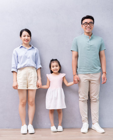 Young Asian family sitting on the floorの写真素材