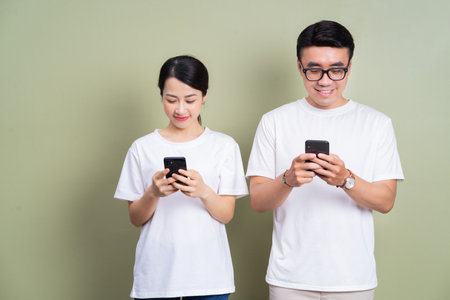Young Asian couple on background