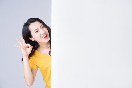 Young Asian woman with stomachacheの写真素材