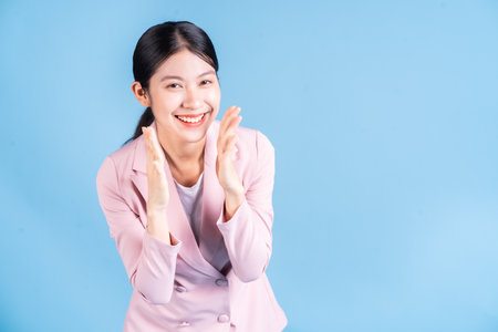 Full length image of young Asian studentの写真素材