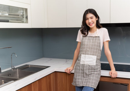 Full length photo of young Asian woman on backgroundの写真素材