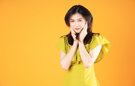 Image of beautiful young Asian woman on backgroundの写真素材