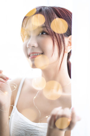 Beauty image of young Asian woman at home in the morningの写真素材