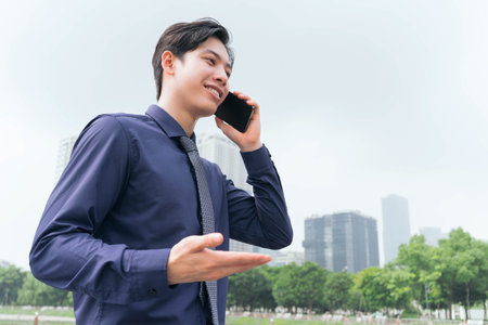 Photo of Asian businessman outdoorsの写真素材