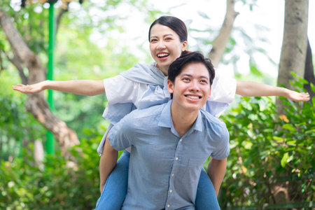 Image of young Asian couple outsideの写真素材