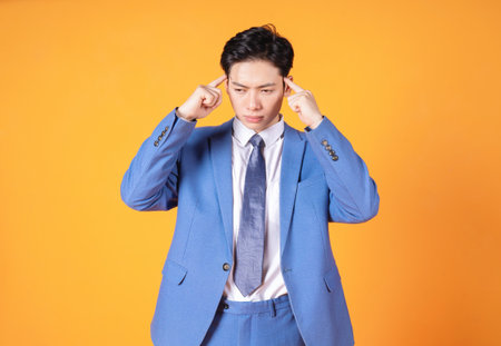 Photo of young Asian business man on backgroundの写真素材