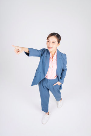 Full length image of young Asian businesswomanの写真素材