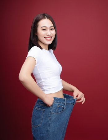 Young Asian woman weight loss backgroundの写真素材