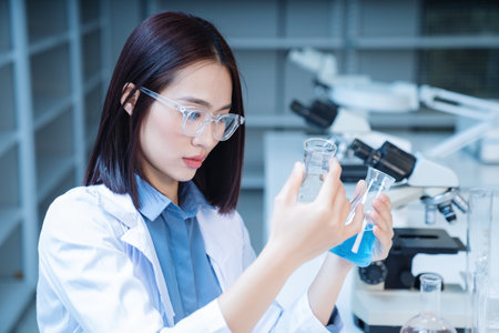 Image of young Asian woman working in the labの写真素材
