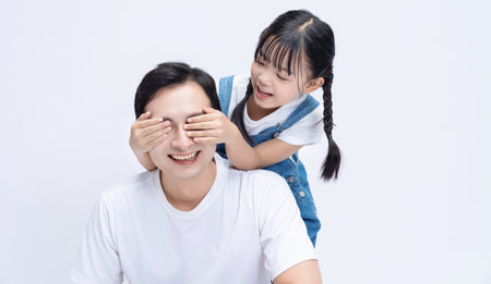 Image of Asian father and daughter on backgroundの写真素材