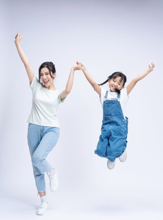 Image of Asian mother and daughter on backgroundの写真素材