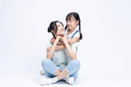 Image of Asian mother and daughter on backgroundの写真素材