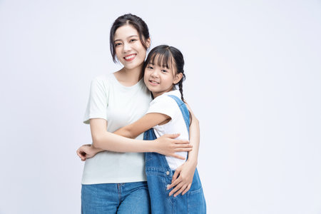 Image of Asian mother and daughter on backgroundの写真素材