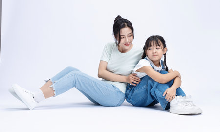 Image of Asian mother and daughter on backgroundの写真素材