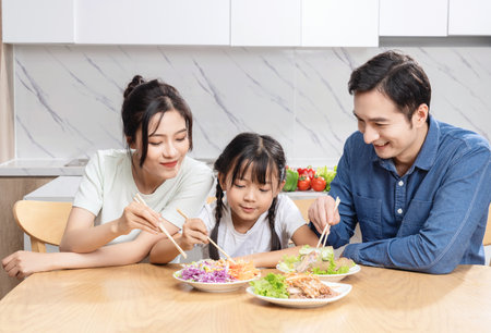 Image of Asian family in the kitchenの写真素材